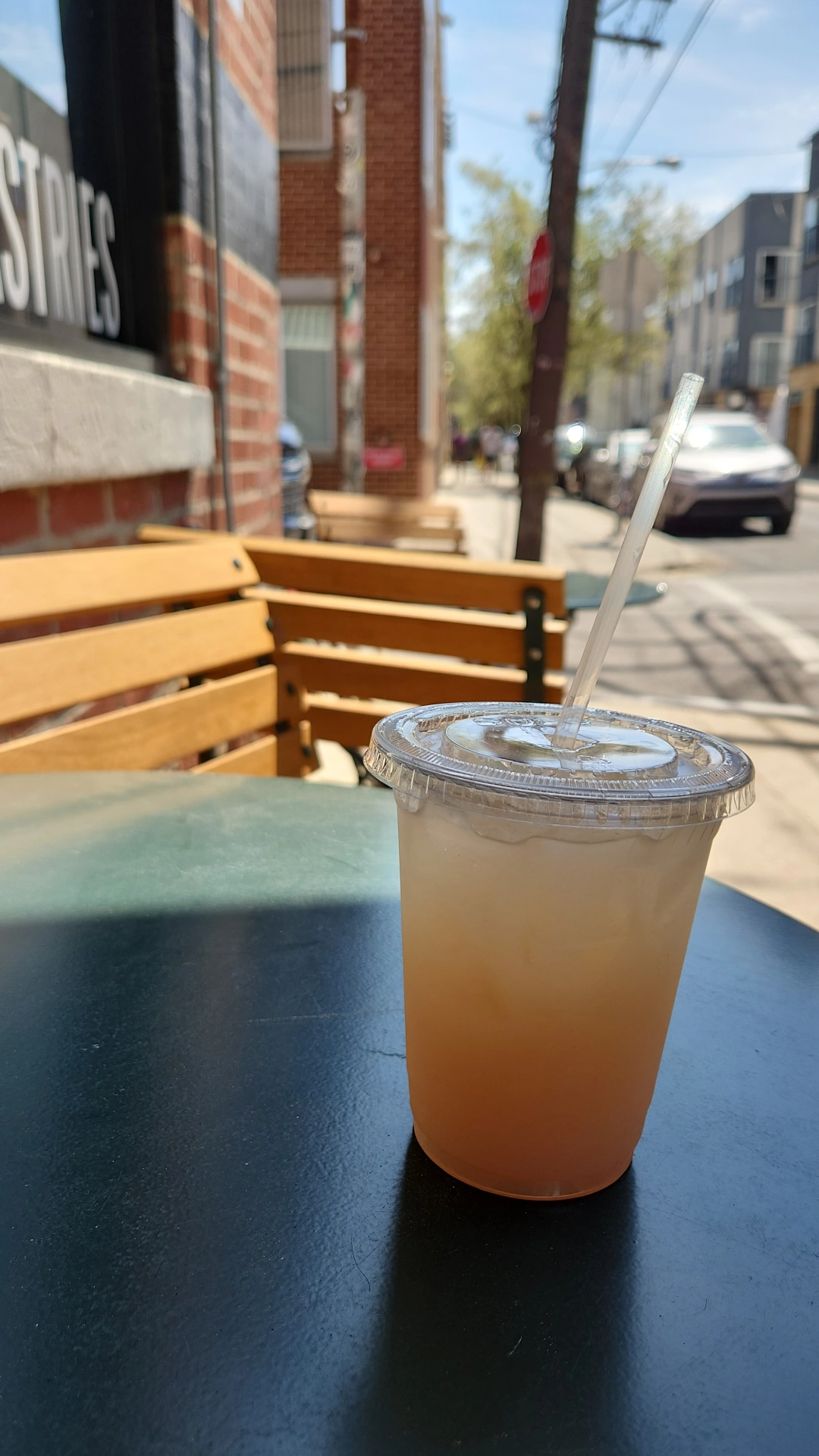 A drink sitting on a table outside of One Shot Cafe - Philadelphia